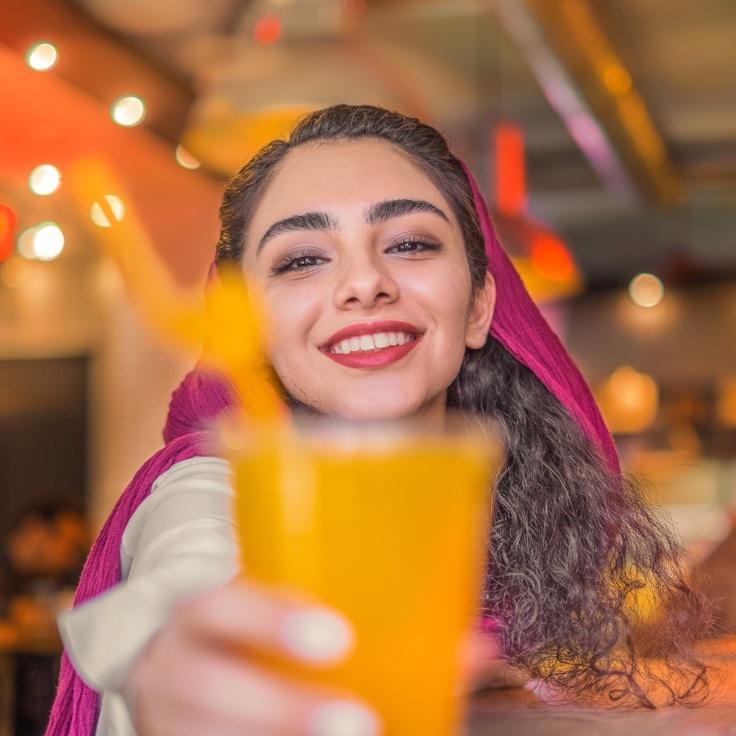 Kaveri Mehta, Lead Design Curator at Ever Green Project Hub, reviewing corporate floral arrangements